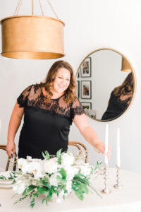 Kirsten Kakarigi, top Sacramento wedding planner, designs a table setting at her studio in Old Roseville. 