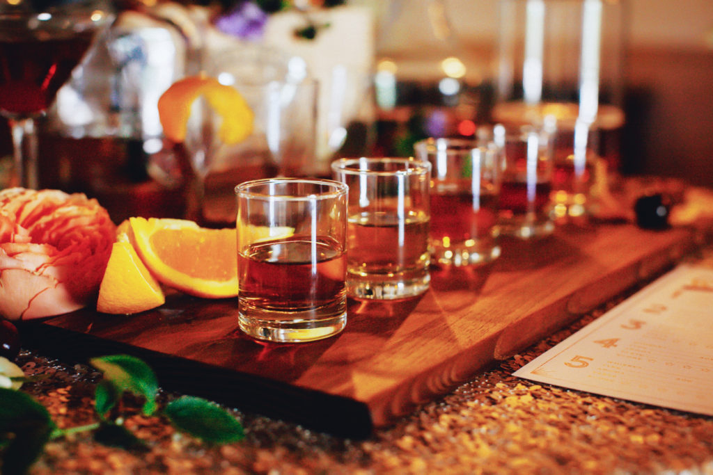 Setting up glasses of whiskey for a whiskey tasting party by Sacramento event planner, KMK Design. 